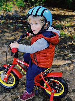 Henry can now ride on his bike safely with his new helmet.